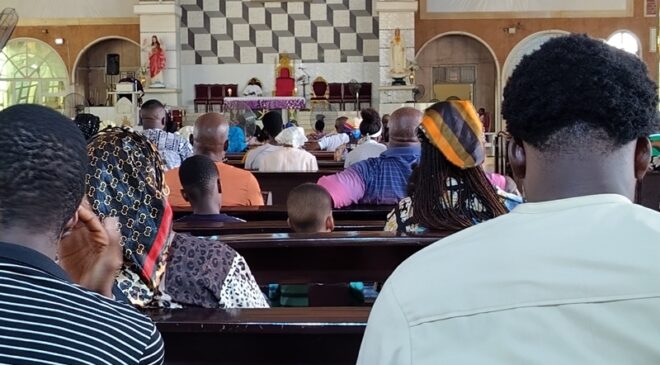 Worshippers seated in reverent silence during the midday Ash Wednesday Mass at St Patrick Catholic Church West End, as the congregation begins the Lenten season with prayer and reflection in Asaba